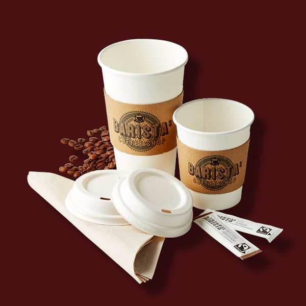 Barista paper coffee cups with brown bands and plastic lids surrounded by coffee beans and napkins on dark background.