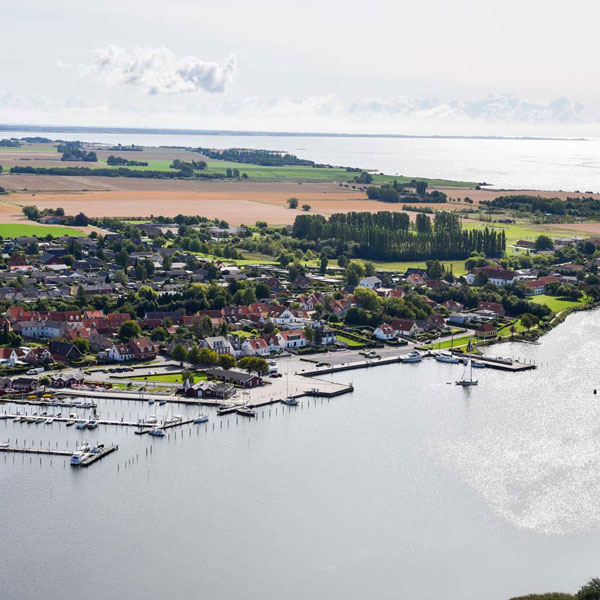 Aerial view of Lolland harbor with clearly visible boats and piers.